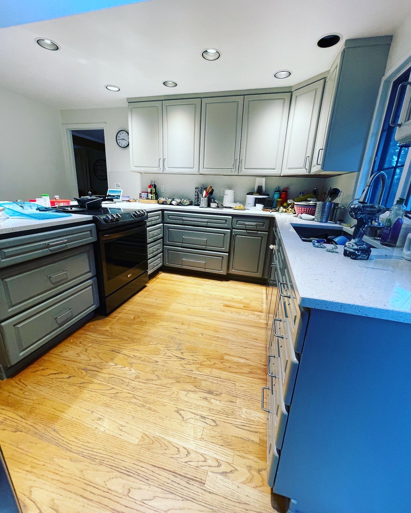 Gray painted kitchen cabinets after refinishing
